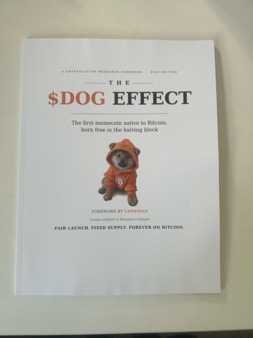 The cover of 'THE $DOG EFFECT,' a crypto research handbook describing itself as 'The first memecoin native to Bitcoin, born free in the halving block,' featuring a Shiba Inu puppy in an orange hoodie with foreword by Leonidas.