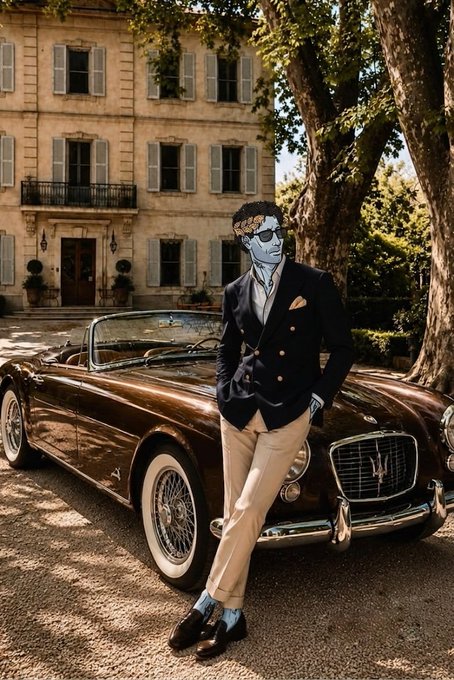 An illustrated figure with a blue face, wearing sunglasses, a dark blazer, and cream trousers, leans against a vintage brown convertible sports car parked in front of a grand European-style estate.