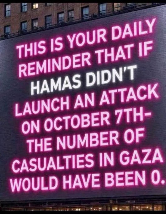 An electronic billboard displaying a political message in pink and white text reading: "THIS IS YOUR DAILY REMINDER THAT IF HAMAS DIDN'T LAUNCH AN ATTACK ON OCTOBER 7TH - THE NUMBER OF CASUALTIES IN GAZA WOULD HAVE BEEN 0."
