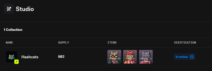 The image shows the OpenSea Studio dashboard displaying the "Hashcats" collection with a supply of 802 items, featuring pixel art cat characters and a blue "In review" status indicator. This relates to the post by indicating that the Hashcats collection is currently awaiting OpenSea's verification process.