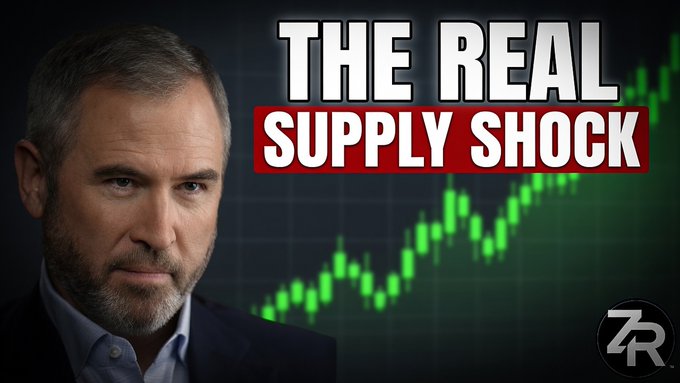 The image features a man wearing a suit with a serious expression, looking directly at the camera while he appears to be giving a speech or presenting something related to finance. The backdrop for his presentation has multiple lines of charts depicting a stock market chart, which is a visual representation of supply and demand trends in the cryptocurrency market.

In the image, there are also some text elements that seem to be part of an article discussing the real supply shock associated with bitcoin prices and other cryptocurrencies. This suggests a connection between the man's presentation on finance and potential issues related to the crypto market.