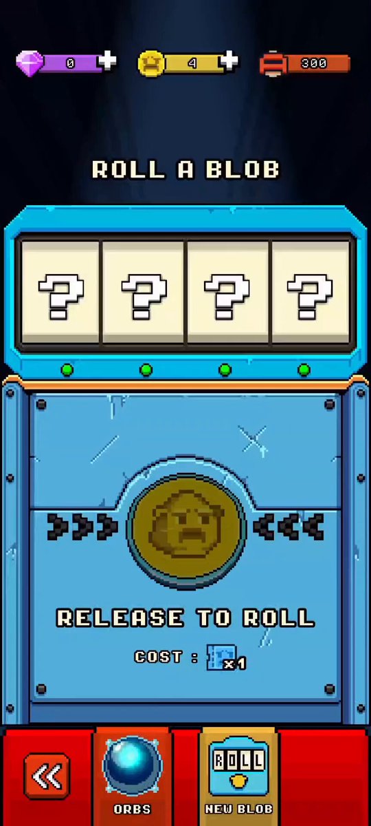 The image shows a blue machine with a white screen displaying a game interface, likely for a video game or mobile app. The text "Roll a Blob" is visible at the top of the screen, indicating that the player must roll a certain number on the screen to proceed in the game. There are four buttons on the screen, each labeled with numbers from 1 to 4, which could be used to determine the outcome of rolling the dice. The machine also has a "Release to Roll" button at the bottom, suggesting that players can choose their preferred outcome and start playing immediately.