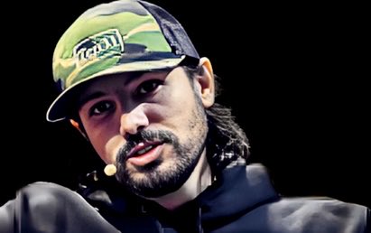 A bearded man wearing a camouflage trucker hat with the "TRUHODL" logo speaks into a headset microphone against a dark background, suggesting he is appearing as a guest or speaker on a podcast or panel. The image aligns with the post's reference to a public figure, likely one associated with the Bitcoin and open-source funding community, given the hashtags #OpenSats and #Ten31.