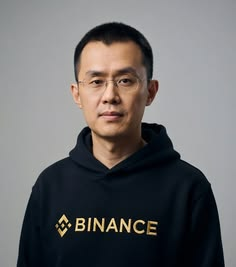 Binance co-founder Changpeng Zhao (CZ) is shown wearing a black hoodie with the "BINANCE" logo, as he announces plans to stop using a public wallet due to an overwhelming flood of unsolicited meme coins making it difficult to locate his $BNB holdings.