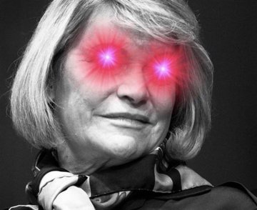 Senator Cynthia Lummis is pictured in a black-and-white portrait with glowing red laser eyes added as a digital effect, visually amplifying the bold, combative tone of her statement championing the Clarity Act and her "Build Here. Stay Here. Grow Here." rallying cry for U.S.-based crypto innovation.