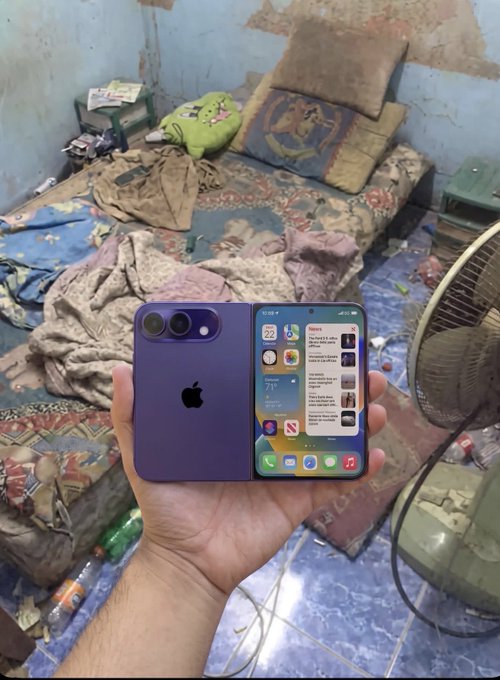 A hand holds open an iPhone Duo in purple, displaying a home screen with widgets showing the date "22" and weather "21°C," set against a backdrop of a cluttered room with bedding and a green pillow. The foldable dual-screen device ties into the post's hype about "CT" (Crypto Twitter) users trading memecoins on this innovative new phone.