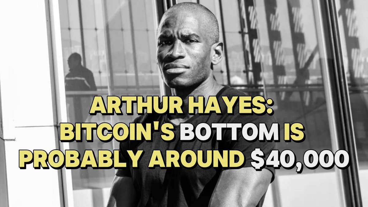 The image presents a black and white photograph of a man wearing a black t-shirt. Behind him, there are blurred people which appear to be individuals walking around. Above them, an interesting text appears that is in a yellow color with both lowercase letters and uppercase letters in the same font size - it reads: "Arthur Hayes: Bitcoin's Bottom Is Probably Around $40,000 On June 12, 2016." This suggests that Arthur Hayes made an educated guess about Bitcoins' bottom price on June 12, 2016. The man is standing next to a building with large windows and two pillars supporting a balcony.