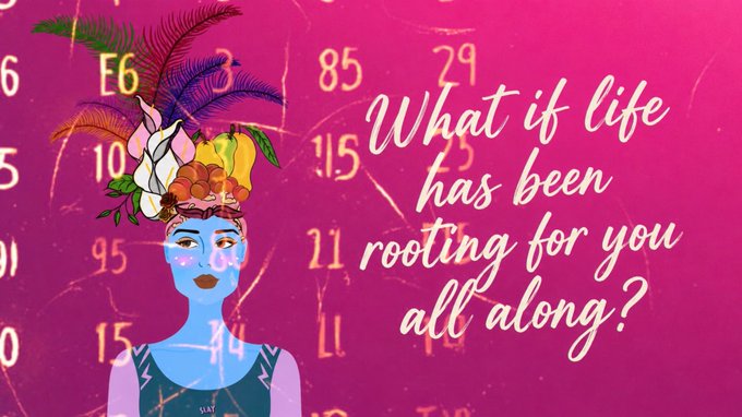 A vibrant illustration features a woman with blue skin and an elaborate headdress of tropical flowers and feathers against a pink backdrop filled with numbers and the phrase 'What if life has been rooting for you all along?' in white script.
