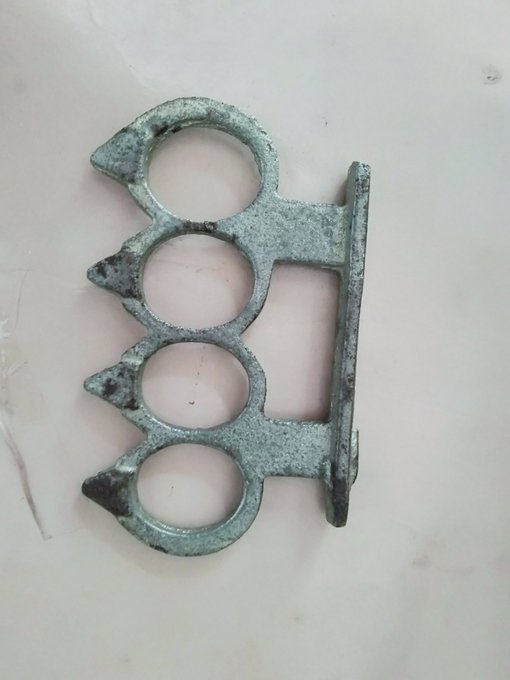 The image features a pair of metal knuckles, possibly made from steel or iron, with a silver finish that gives them an antique appearance. The knuckles are positioned against a white background, which highlights their metallic sheen. The text "Gm all my #X member havy nice day" is written in the caption below the image, but it does not provide any additional information about the knuckles or their context.