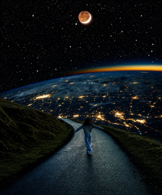 A person walks down a winding road on a grassy hillside overlooking the glowing lights of Earth from space, with a crescent moon and stars visible above.