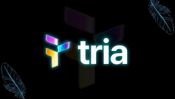 The image features a logo with the word "Tria" written in white letters, surrounded by a neon glow that gives it an artistic touch. The background of the image is black, which contrasts nicely with the glowing logo. There are two blue feathers placed on either side of the logo, adding to its visual appeal and making it stand out even more.