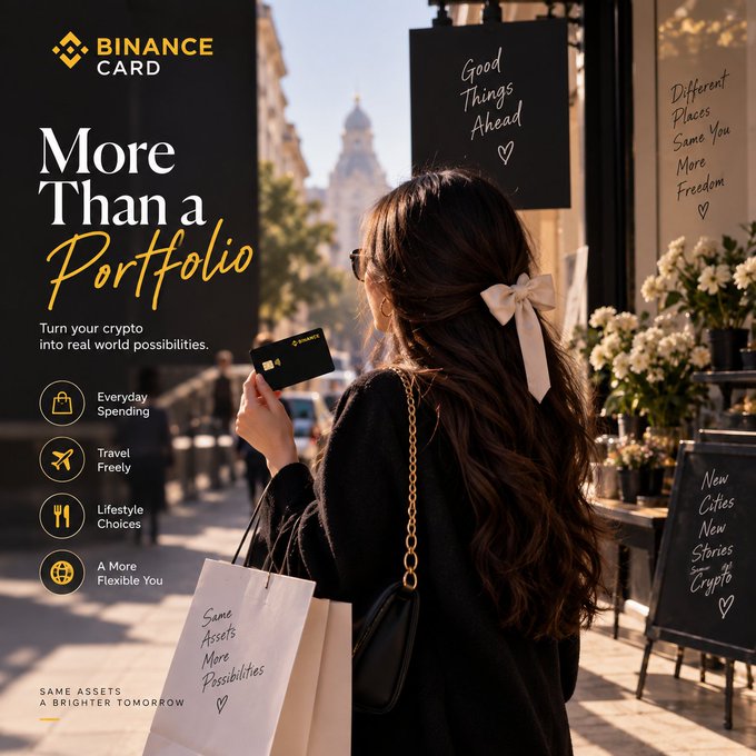 The image is a Binance Card promotional advertisement featuring a woman with long, wavy hair tied with a cream-colored bow, holding a Binance Card while carrying a shopping bag that reads "Same Assets More Possibilities," set against an urban backdrop with chalkboard signs displaying phrases like "Good Things Ahead," "Different Places Same You More Freedom," and "New Cities New Stories Crypto." The ad's tagline, "More Than a Portfolio," promotes turning crypto into real-world possibilities through benefits like everyday spending, travel freedom, lifestyle choices, and a more flexible lifestyle, aligning with the post's message about crypto transitioning from a mere watched asset to a tool for real-world use via the Binance Card.