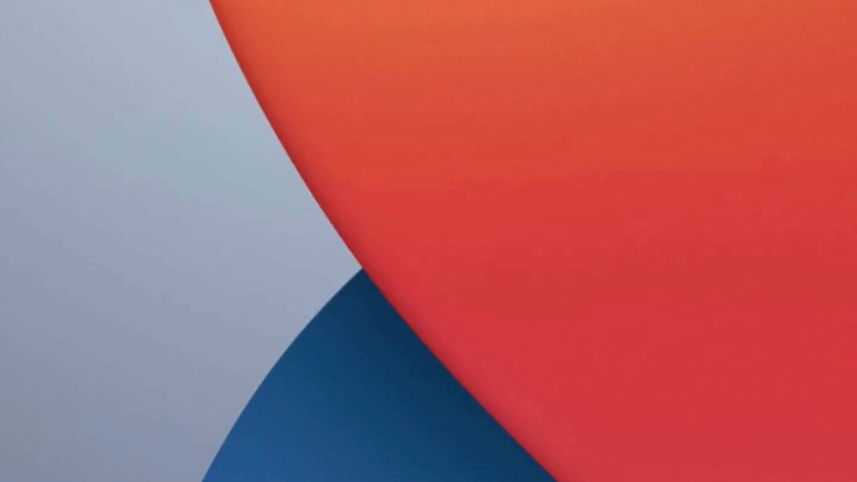 The image shows a poster with a unique design featuring a border composed of two distinct colors - blue and red. The entire background, including the bottom edge of the poster, is white. In the center of this striking visual display, there's an orange shape that stands out against the neutral tones of the background. This vibrant color contrasts sharply with the lighter shades surrounding it.