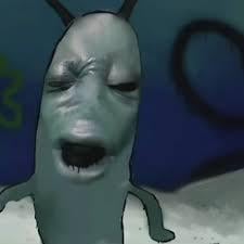 The image features a cartoon character resembling a slug or a green alien with a face, standing against a blue background. The character appears to be making a funny facial expression, possibly due to being nuked multiple times. The caption below the image reads "Solana nuked again 😭😭".