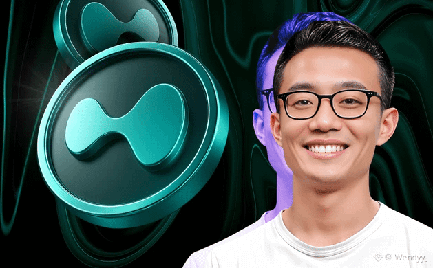 A smiling young man wearing black-rimmed glasses is pictured on the right side of the image against a dark, swirly background featuring teal 3D-rendered Hyperliquid logo coins on the left. The watermark "© Wendyy" appears in the bottom right corner, and the image visually represents the post's message about Hyperliquid's ($HYPE) unique ecosystem that competitors have failed to replicate.