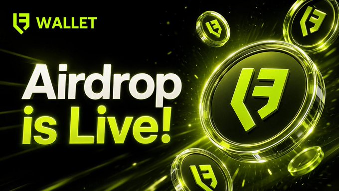 Promotional banner for the LF Wallet (LWT) airdrop, displaying "WALLET" branding and "Airdrop is Live!" in bold white and green text against a dark background, accompanied by glowing LWT coins. The design visually reinforces the announcement that participants can earn 500 LWT tokens by completing required airdrop tasks.