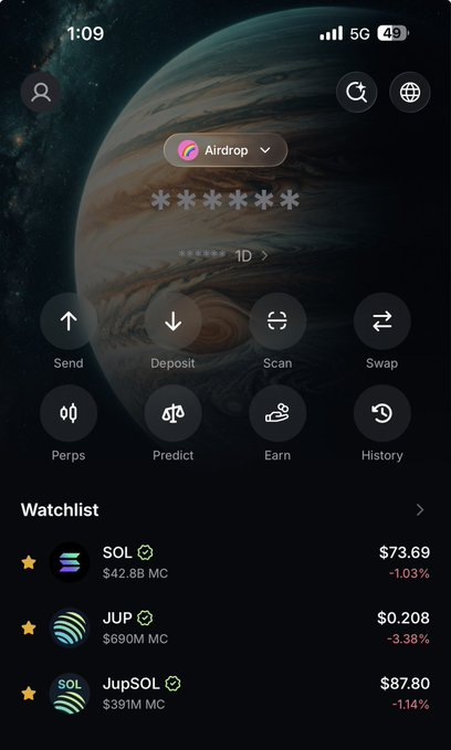 A crypto wallet app home screen showing a hidden wallet (asterisks) ending in 1D with action buttons for Send, Deposit, Scan, Swap, Perps, Predict, Earn, and History, plus a Watchlist tracking SOL ($73.69), JUP ($0.208), and JupSOL ($87.80).