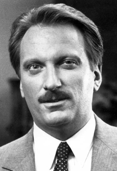 A black-and-white portrait of a man with a mustache wearing a suit and polka-dot tie—styled to evoke the iconic look of the principal from *Ferris Bueller's Day Off*. The caption references Edward Rooney, suggesting the image illustrates the post's playful jab at interns behaving recklessly because a more polished one gives them misguided confidence.