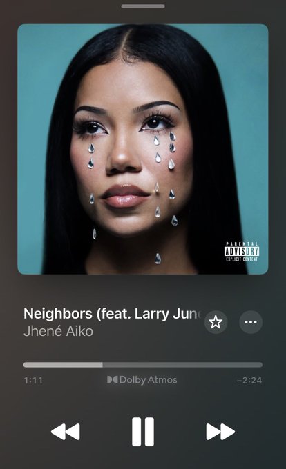 A smartphone music player interface showing Jhené Aiko's song "Neighbors (feat. Larry June)" with album art featuring a woman with diamond-shaped tears.