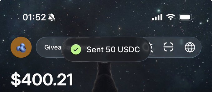 A smartphone home screen displays a balance of $400.21 against a starry night background, with a notification showing "Sent 50 USDC," confirming the 50 USDC prize payout to @defiidamii mentioned in the post.