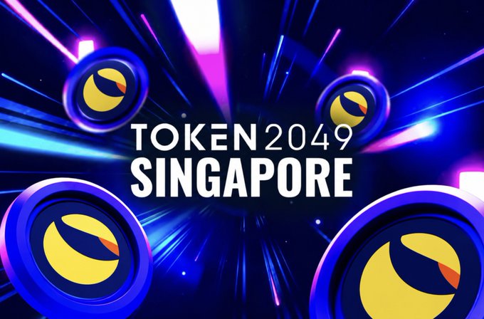 A vibrant promotional banner for 'TOKEN2049 SINGAPORE' featuring stylized circular logos with eye-like designs against a colorful, energetic background of blue, pink, and purple light streaks.