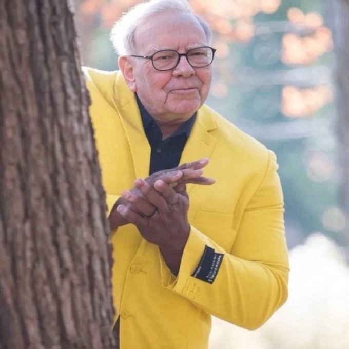 The image features an older man wearing a yellow jacket, standing next to a tree with his hands clasped together. There are also some text elements present in the image that read "When $DOGE is down a thousandth". This suggests that there might be a connection between the dog and the post or the context of the photo being related to the dog's name or something else involving dogs.

The man appears to be dressed for cooler weather, as he is wearing a yellow jacket. The image captures an interesting moment where the man is interacting with his surroundings while still maintaining some level of connection to the text in the image.