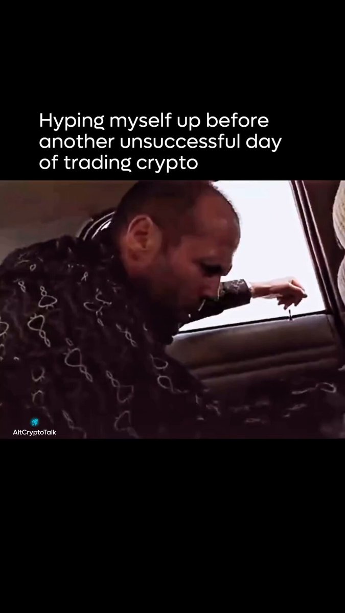 The image shows a man leaning out of a car window, with his hand extended towards the glass. The caption below the photo reads "Hyping myself up before another unsuccessful day of trading crypto", which seems to be a humorous statement about the challenges faced by cryptocurrency traders.