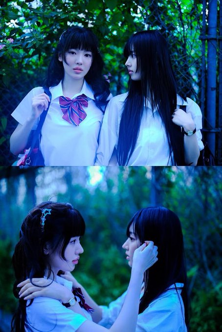 A vertically stacked image of two girls in white school blouses in a forest setting, with the top panel showing one looking at the camera and the bottom showing them face-to-face in an intimate pose.