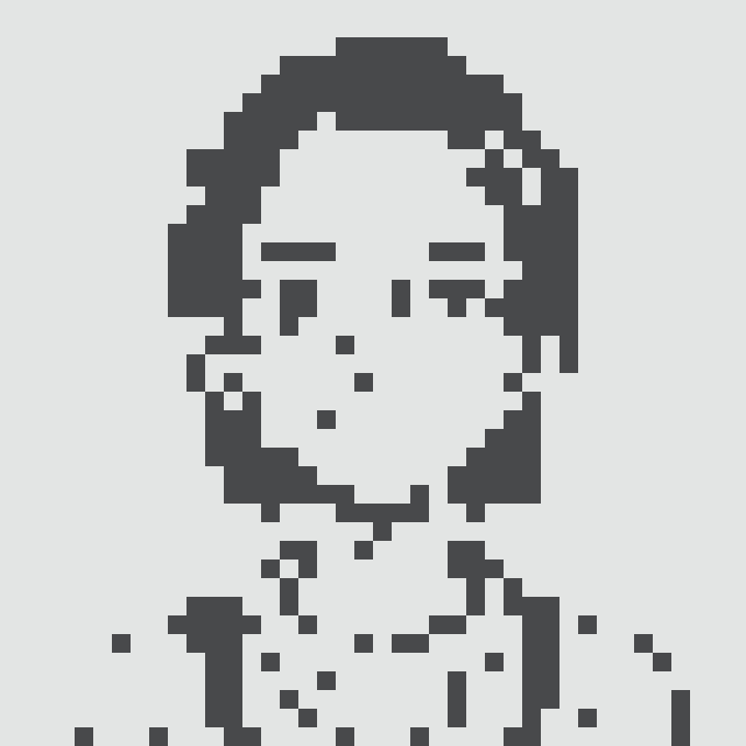 A dark gray pixel art portrait of a young man with a slight smile, with hair falling around his face.