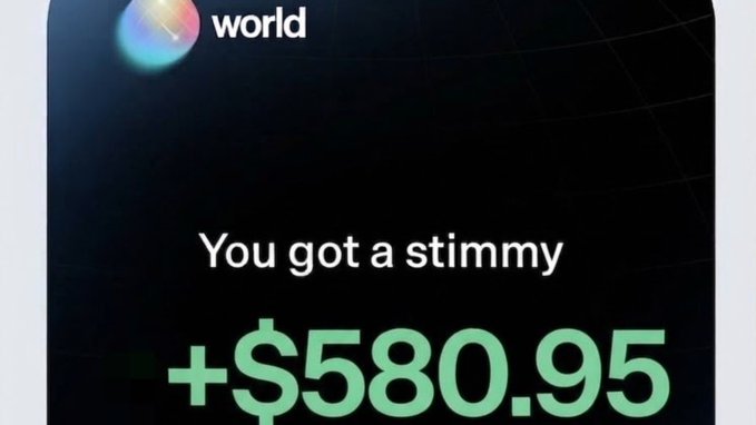 The image shows a screenshot from World (formerly Worldcoin) displaying a notification that reads "You got a stimmy" with an amount of "+$580.95" in large green text, visually supporting the post's claim of receiving over $500 from the platform.