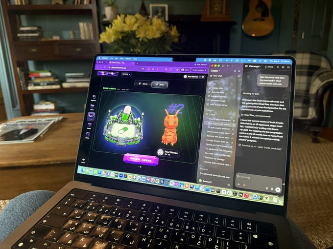 A MacBook laptop screen displays what appears to be a creative AI tool generating a 3D diorama image of a crab character, with chat windows and browser tabs visible. A guitar and flowers are in the background.
