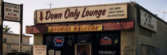 A storefront sign for "Down Only Lounge" advertises cocktails, beer, wine, and an ATM, with neon Pabst and Coors signs in the windows and a banner reading "NORMIES WELCOME." The post appears unrelated, as it discusses a RH token project on OpenSea, making the bar image an unrelated visual.