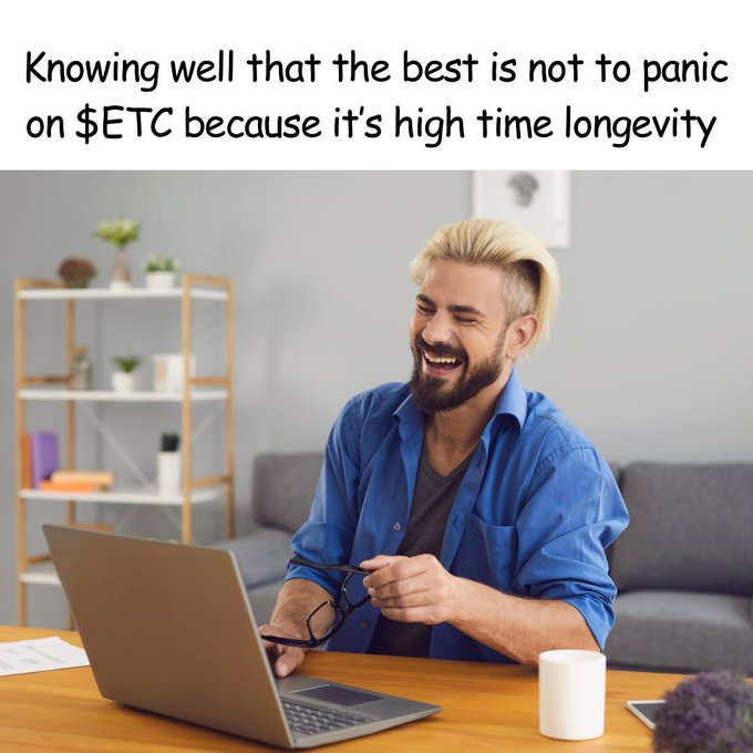 A meme featuring a smiling man with blonde hair and a beard sitting at a desk with a laptop, captioned 'Knowing well that the best is not to panic on $ETC because it's high time longevity'.