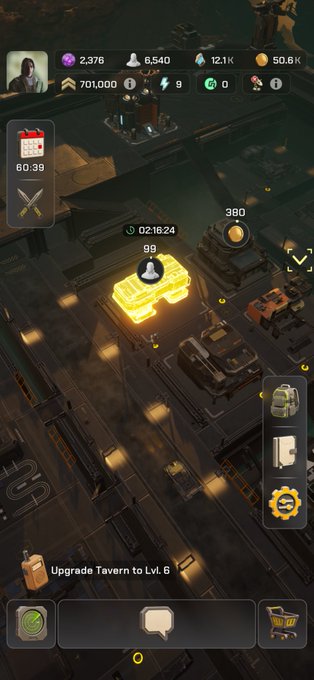A mobile game screenshot showing an industrial base with resource counters at the top (2,376, 6,540, 12.1K, 50.6K, 701,000) and a prompt to 'Upgrade Tavern to Lvl. 6' at the bottom.