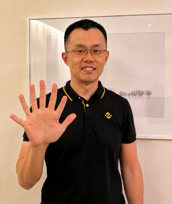 A man wearing glasses and a black polo shirt with a Binance logo smiles and holds up his hand, displaying all five fingers. The accompanying Ethereum address "0x7A848a5A8169aa6a2f603D056A749f924F504444" likely represents his crypto wallet, tying the image to a cryptocurrency context.