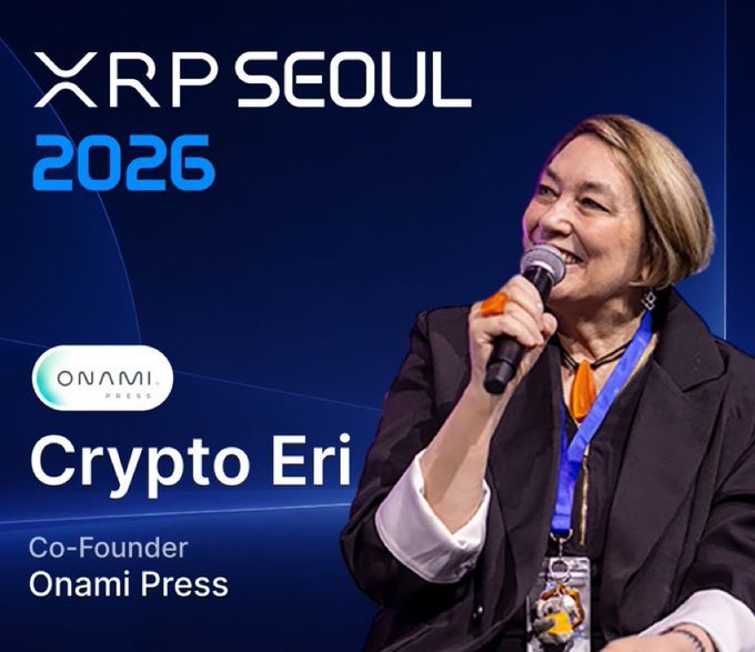 Event photo showing "XRP SEOUL 2026" and "ONAMI PRESS" with "Crypto Eri, Co-Founder Onami Press" identified below, featuring a smiling woman speaking into a microphone.