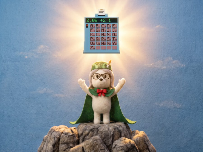 A 3D-rendered cartoon bear mascot wearing glasses, a green cloak, and a cap stands on a rocky peak with arms raised toward a glowing wall-mounted device displaying letters of the alphabet.