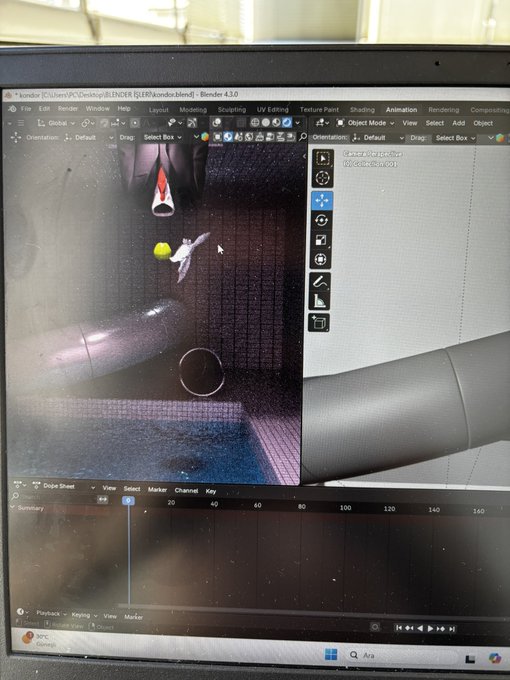 A laptop screen showing the Blender 3D software interface with a 3D model of a character and pipe visible in the viewport, along with a timeline at the bottom.