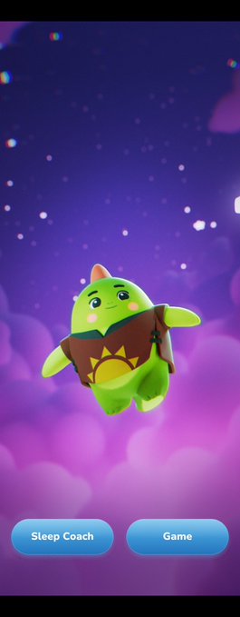 The image features a green cartoon character with a brown hat, flying through space against a purple sky backdrop. The character appears to be wearing a backpack while soaring through the air. Below the image, there are two buttons labeled "SLEEP COACH" and "GAME", suggesting that this is an advertisement for a sleep coaching app or game related to the cartoon character's adventures in space.