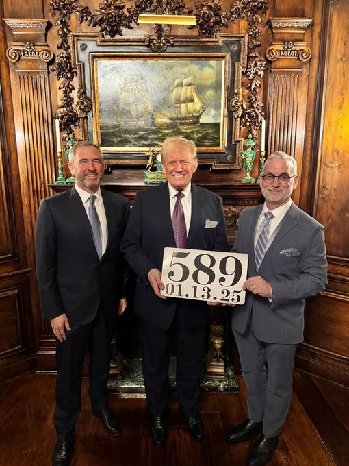 The numbers on the card "58901.13.25" correspond to dates in the year 2025, which seem to be significant to the individuals in the image. The accompanying post suggests a pattern or reference to specific days (1/13, 5/13, 6/28) within a sequence, possibly indicating important dates related to an event or concept denoted by "(L)".