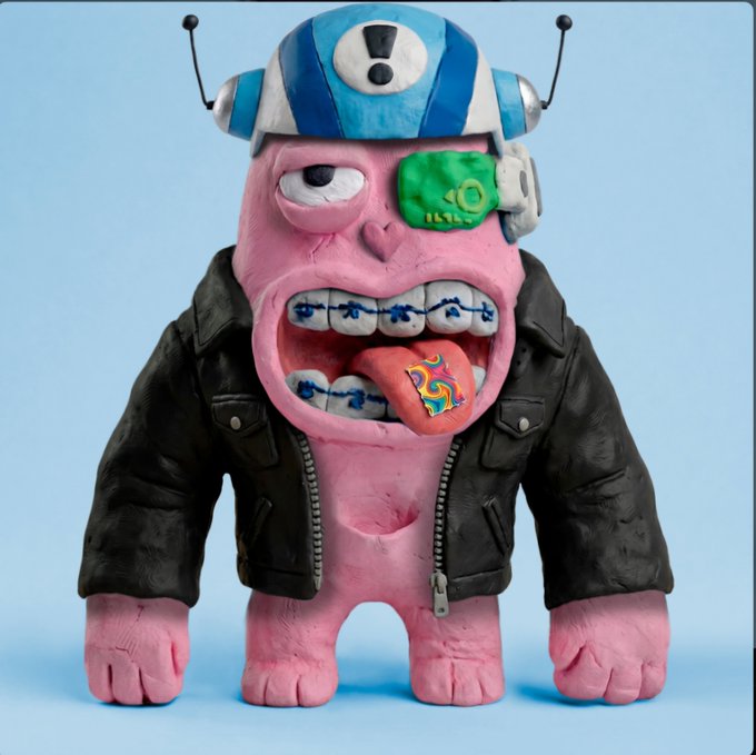 A pink clay sculpture of a Yeti-like monster character wearing a black leather jacket, a blue and white helmet with antennae, and braces with a colorful tongue.