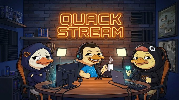 The image features a cartoon duck sitting at a table with three other cartoon ducks, all wearing headphones and holding laptops. The text "Quack Stream" is displayed above them, indicating that they are participating in an online streaming platform called Quack Stream. The cartoon ducks seem to be engaged in a discussion or presentation related to the content on their screens.