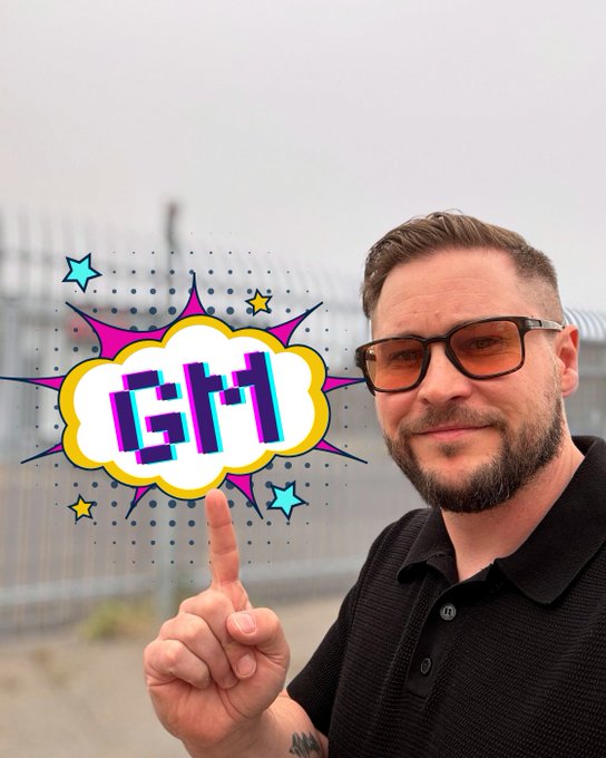 A bearded man wearing sunglasses points upward to a comic-style 'Ctrl' speech bubble graphic overlaid on the image, set against a fenced outdoor background.