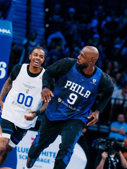 LeBron James, wearing a blue "PHILA" jersey with the number 9 and Penn Medicine logo, practices alongside Labaran Philon, who sports a white jersey marked "00," as Philon watches in awe during a Philadelphia-area basketball session. The image captures the mentor-mentee dynamic referenced in the post, highlighting Philon's visible excitement at sharing the court with the NBA legend amid his new team's star-studded lineup.