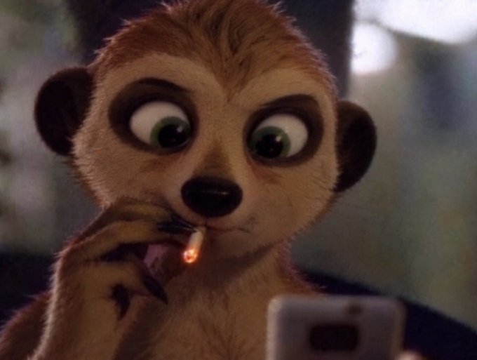 A 3D animated meerkat with large green eyes holds a lit cigarette while looking down at a smartphone.