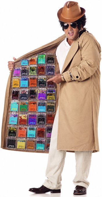 A man wearing a tan trench coat, fedora, and sunglasses opens his coat to reveal rows of small plastic bags labeled 'JPEG' filled with various colorful images.