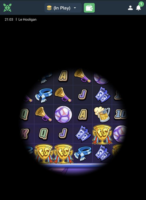 A spooky vignette reveals Duelbits slot game symbols including trophies, vuvuzelas, letter cards (A, J, Q, K) and soccer balls, with the interface showing "21:03 | Le Hooligan" during "(In Play)" mode. The circular spotlight effect and football-themed imagery align with the poster's pitch to follow @Unemployydd and @Duelbits while dropping SOL wallets for tips throughout the week.