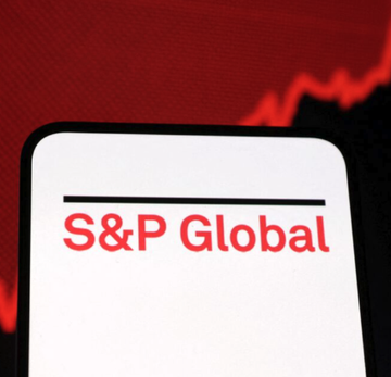 The image shows the S&P Global logo, with "S&P Global" written in red text on a white background, set against a dramatic red backdrop with a dark jagged line resembling a downward stock chart, visually symbolizing market movement. This connects to the post's news that S&P Global is making a bullish move by acquiring OpenZeppelin to enhance its onchain risk assessment capabilities as capital markets increasingly adopt blockchain technology.