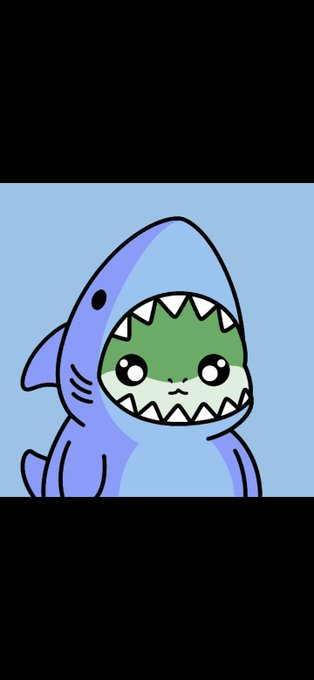 A cartoon illustration of a cute, small green creature with large eyes wearing a blue shark costume, displayed against a blue background.