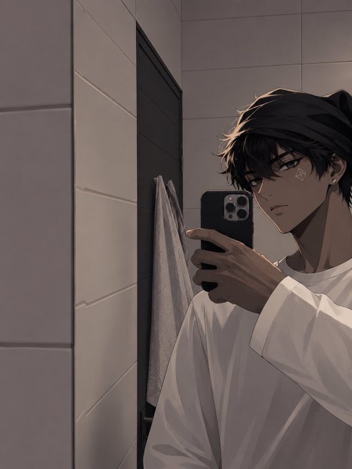 A young man with dark hair takes a mirror selfie in a tiled bathroom, holding up his phone to capture the shot while wearing a white shirt. The image connects to the post as a casual "gm" morning selfie styled in the aesthetic of crypto/Web3 social media culture, where personal mirror selfies are a common way to share daily greetings with the community.